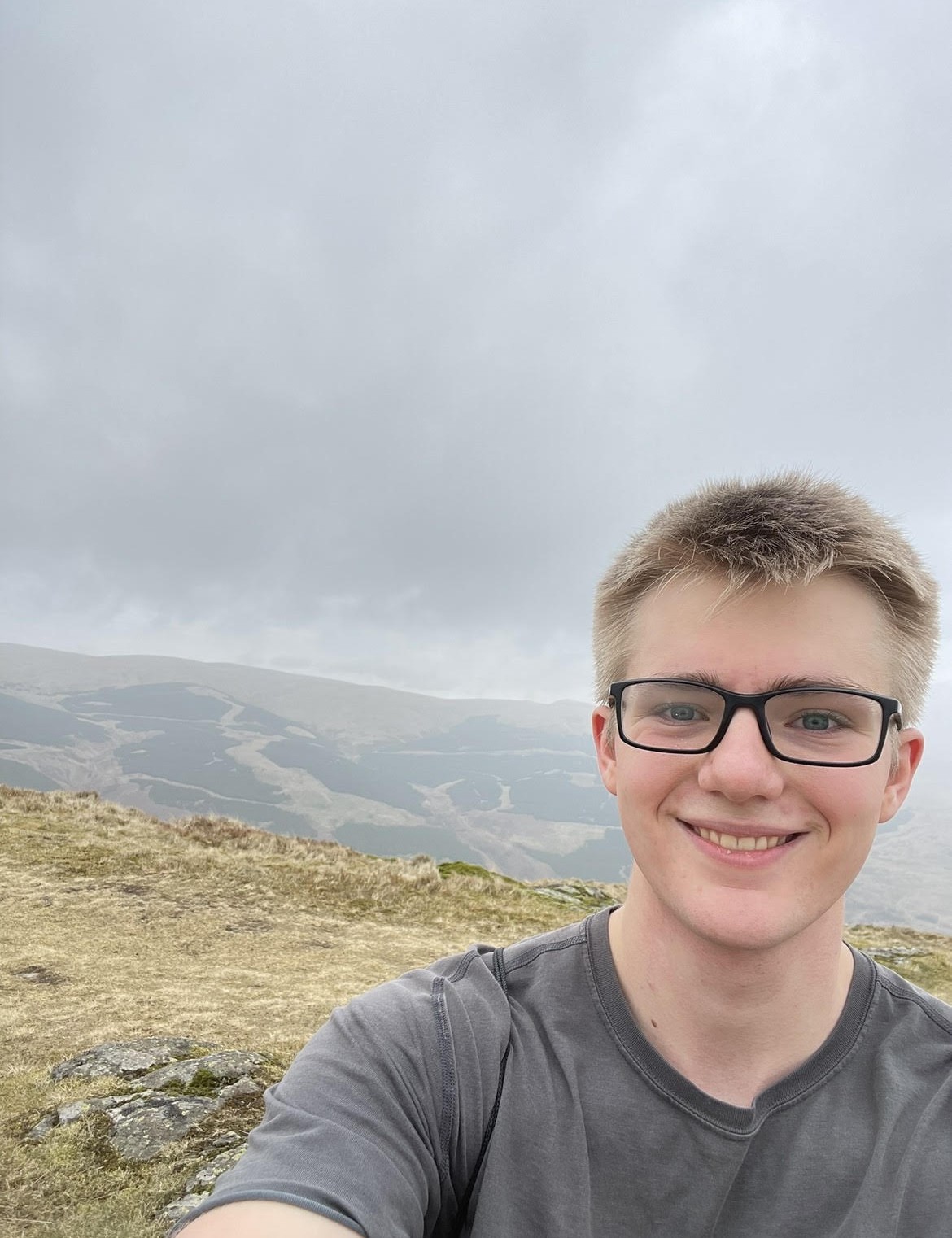 Anderson taking a selfie ontop of a mountain in Scotland