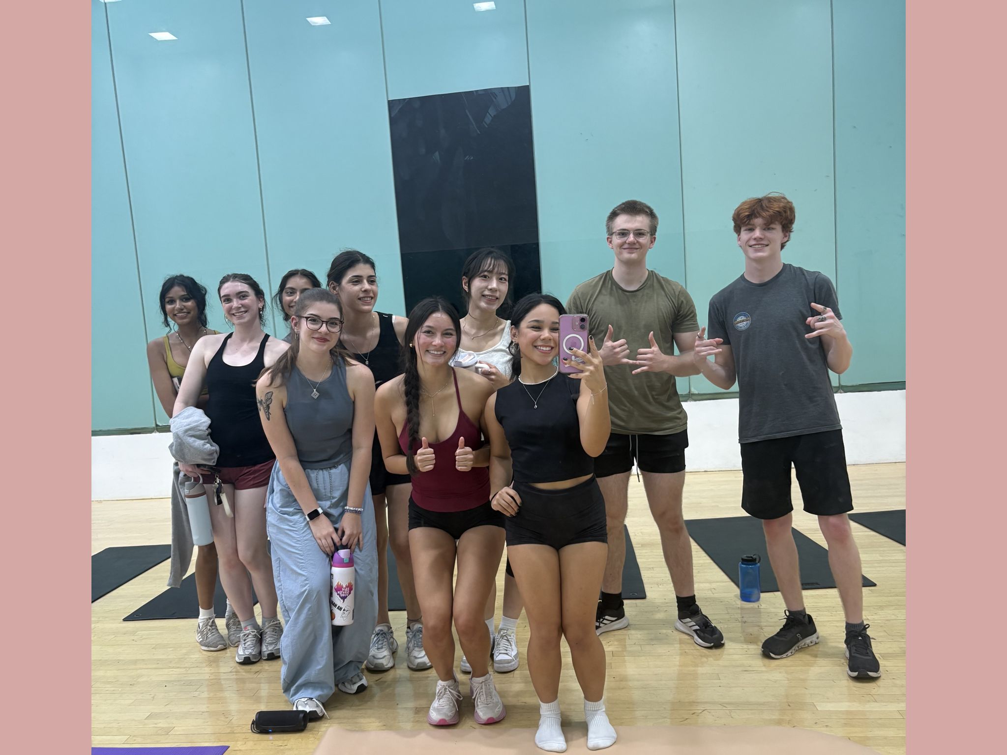 10 VTT members posing in front of a mirror